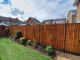 Front view of 6' x 5' Closeboarded Panels fitted between Brown DURA posts and Brown DURA gravel boards. 